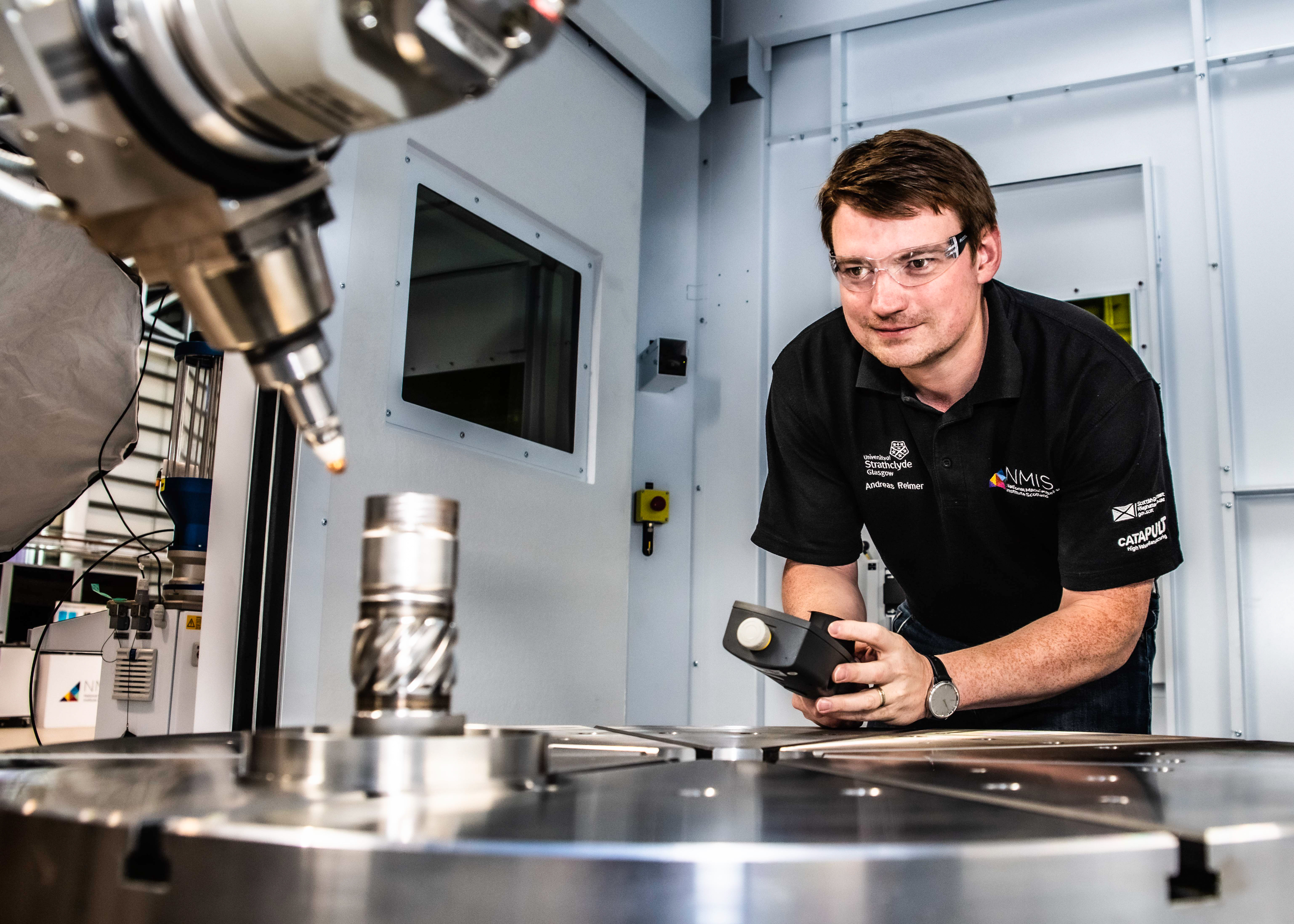a man operating a robot